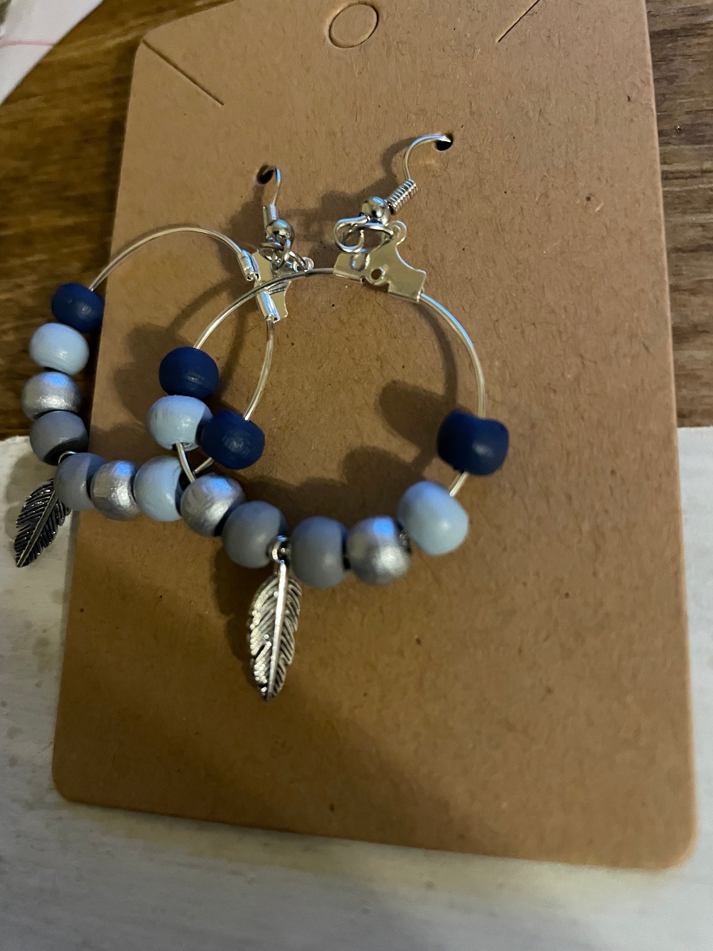 Blue, lightweight earrings with silver feather